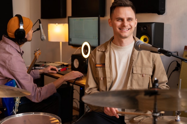 Medium shot  musicians working in studio