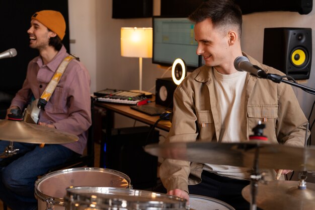 Medium shot  musicians working in studio