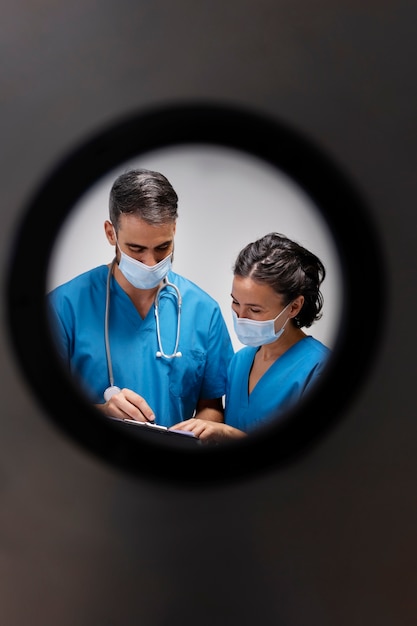 Medium shot nurses discussing at work