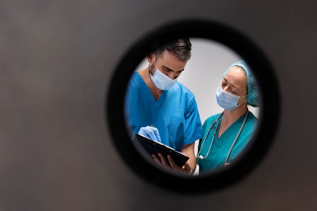 Medium shot nurses with clipboard