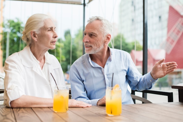 Medium shot old couple talking