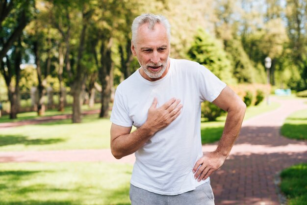 Medium shot old man looking tired