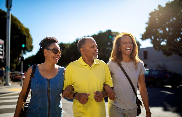 Free photo medium shot old people walking in city