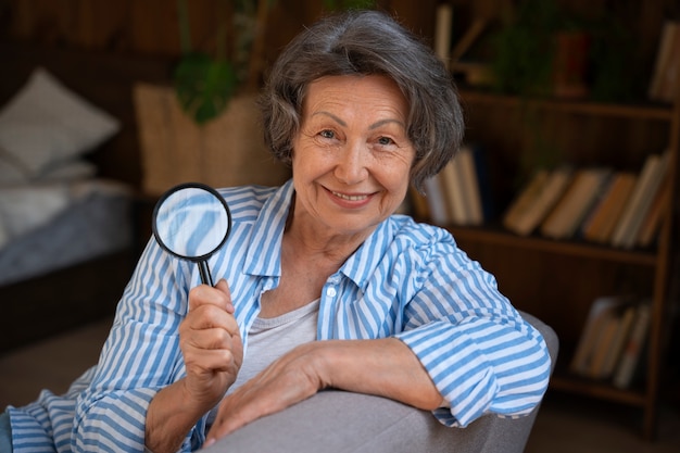 Free photo medium shot old woman in library