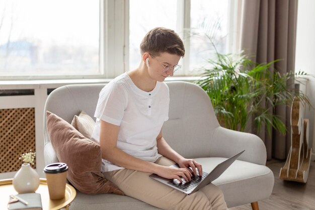 Medium shot parent working on couch