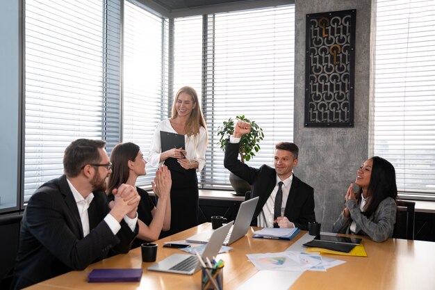 Medium shot people at business meeting