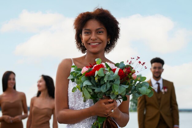 Medium shot people celebrating wedding in nature