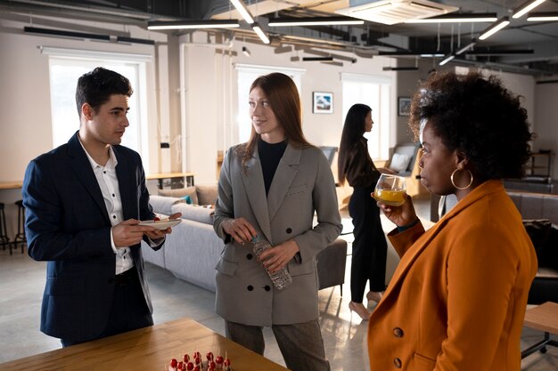 Medium shot people chatting at event