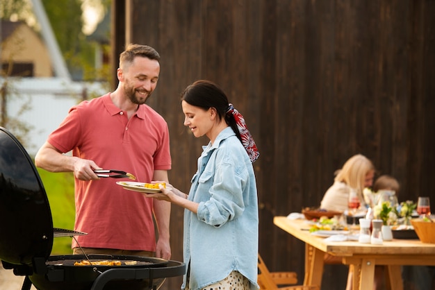 Medium shot people cooking together