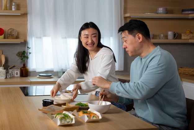 Medium shot people eating asian food