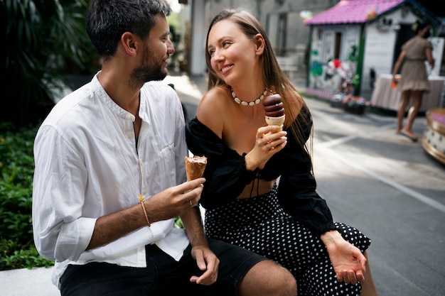 Medium shot people eating ice cream