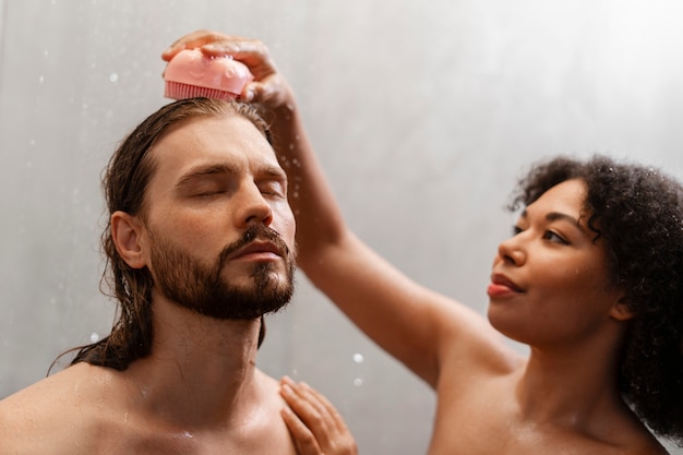 Medium shot people giving themselves scalp massage