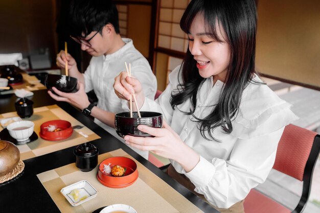Medium shot people holding chopsticks