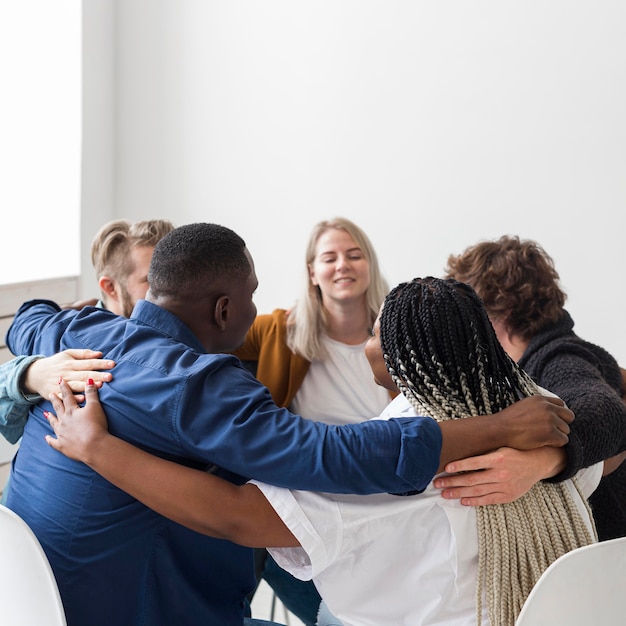 Medium shot people hugging