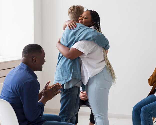 Medium shot people hugging