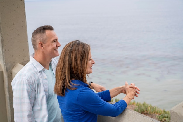 Free photo medium shot people looking at sea