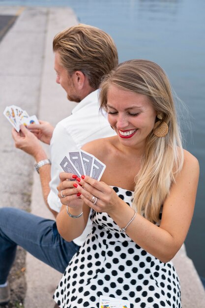 Medium shot people playing cards