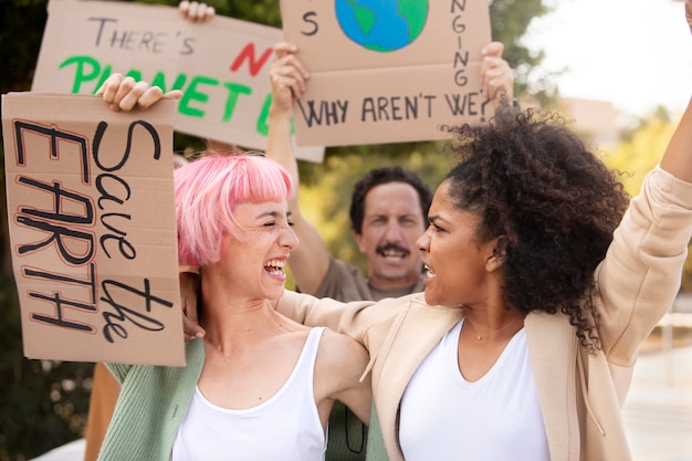 Medium shot people protesting together