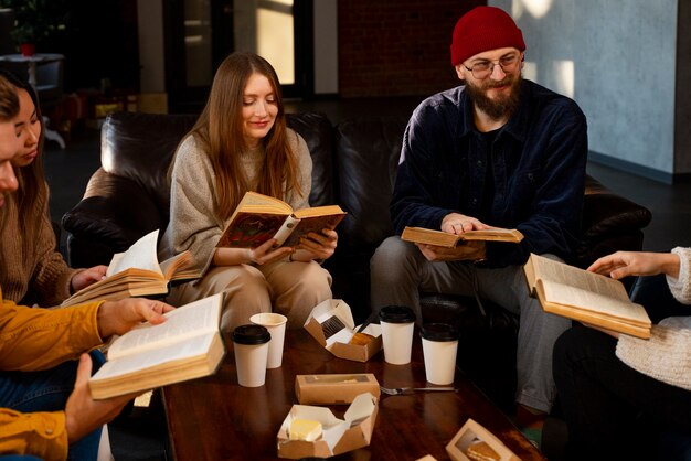 Medium shot people reading together