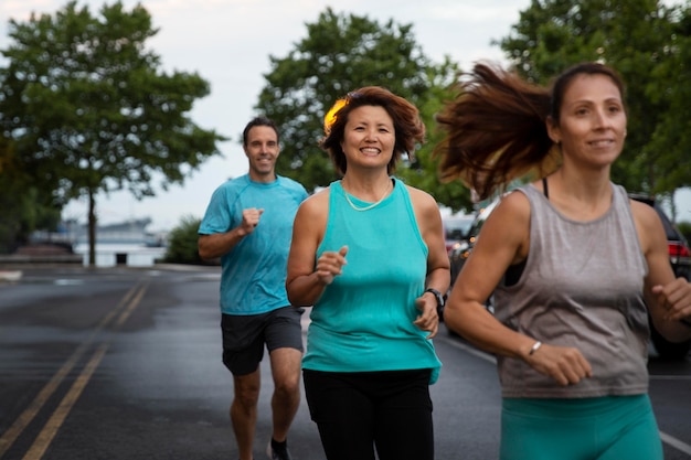 Free photo medium shot people running together