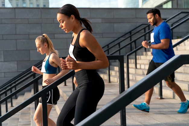 Medium shot people running together