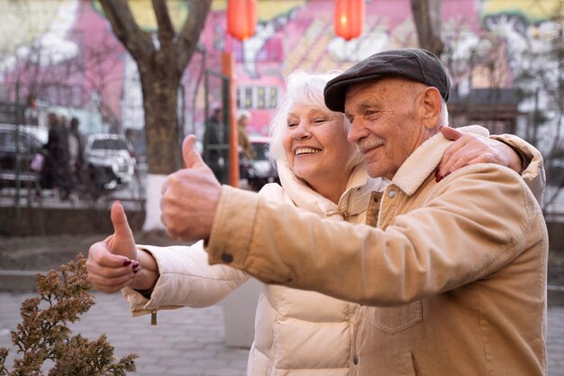 Medium shot people showing thumbs up