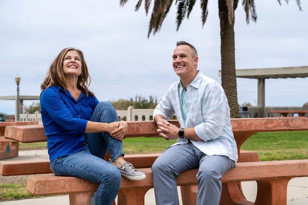 Medium shot people sitting on bench