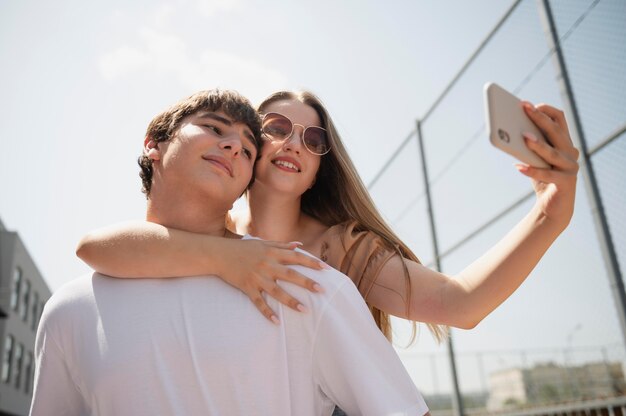 Medium shot people taking selfie