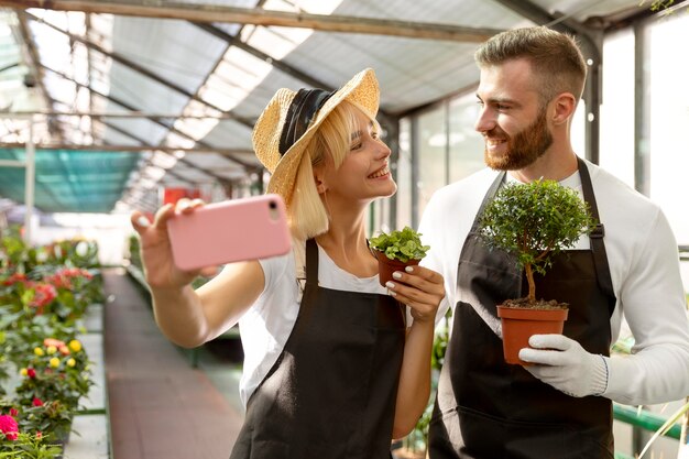 Medium shot people taking selfie