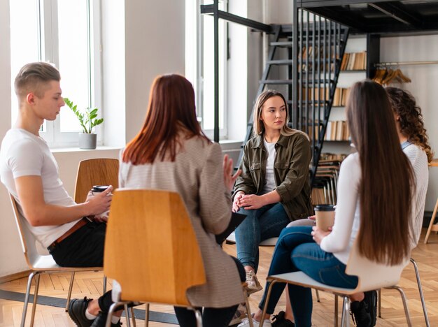 Medium shot people at therapy sitting