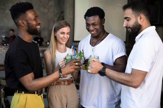 Medium shot of people toasting