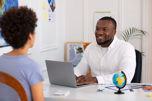 Medium shot people in  travel agency office