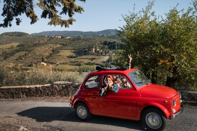 Medium shot people traveling by car