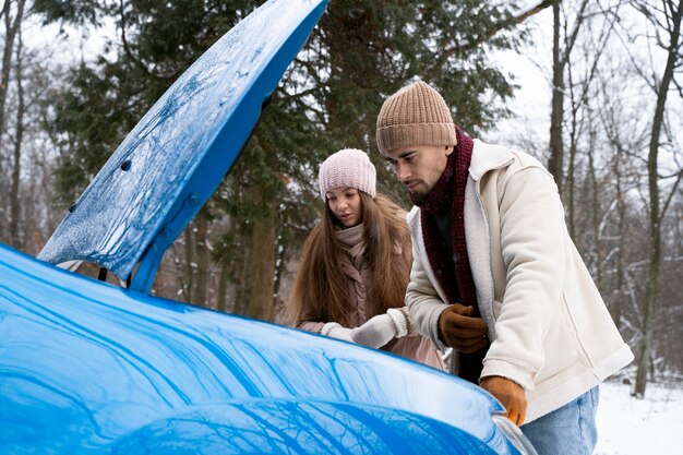 Medium shot people traveling by car