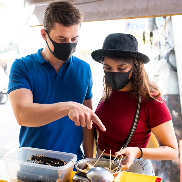 Medium  shot people wearing face masks