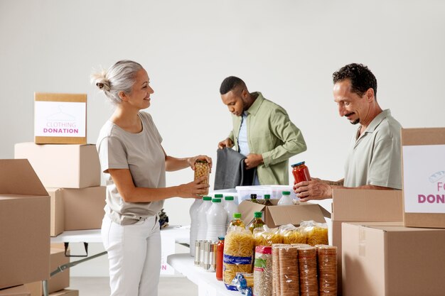 Medium shot people with food donations