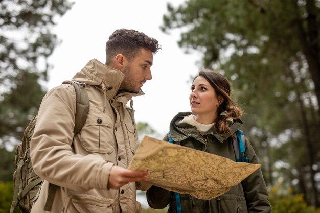 Medium shot people with man in forest