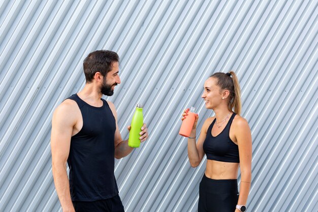 Medium shot people with water bottles