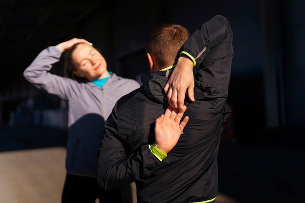 Free photo medium shot people working out together