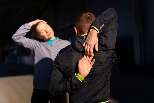 Medium shot people working out together