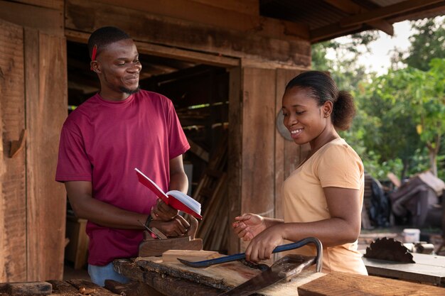 Medium shot people working with wood