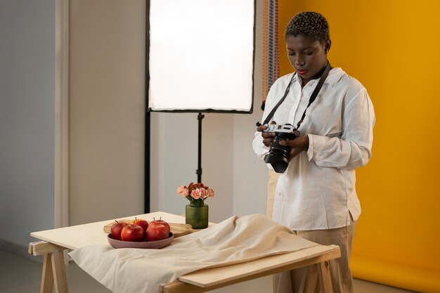 Medium shot photographer taking fruit photos