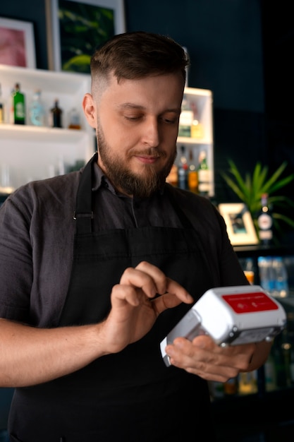 Medium shot plus-size man working as barista