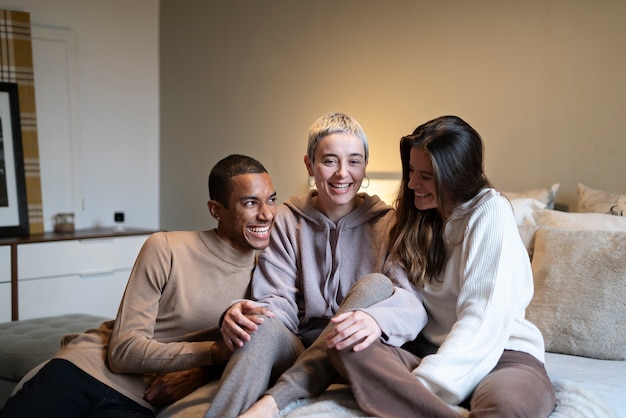 Medium shot polyamorous partners sitting