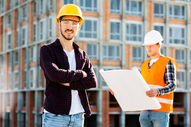 Medium shot portrait of confident architect looking at camera