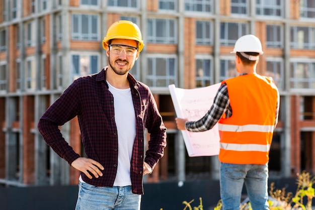 Medium shot portrait of smiling architect looking at camera