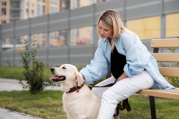 Medium shot pregnant woman with cute dog