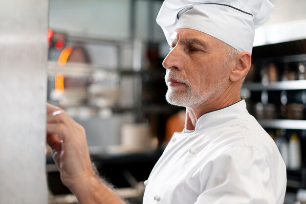 Medium shot professional chef posing