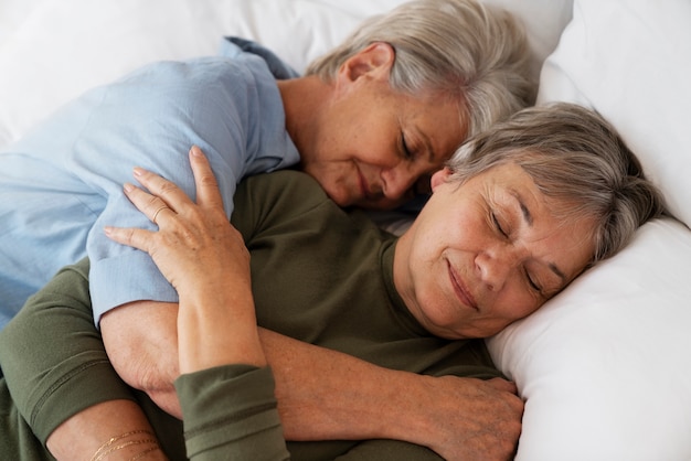 Free photo medium shot queer couple hugging