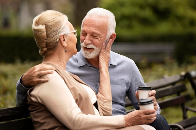 Medium shot relaxing senior couple
